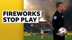Augsburg v Dortmund halted after fireworks land on pitch