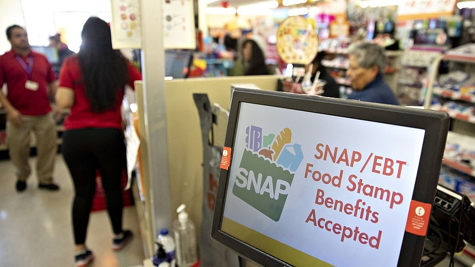 Charts illustrate the scale of SNAP as millions face potential benefit lapse